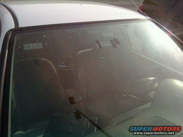 2000 Mercury Grand Marquis interior seen through windshield, dashboard and seats visible