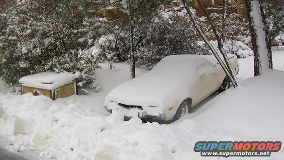 1972 Ford Ranchero covered in snow, front 3/4 view