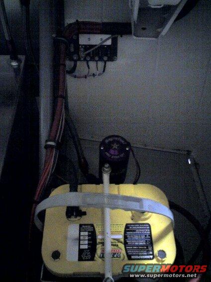 Yellow car battery with wiring and labels