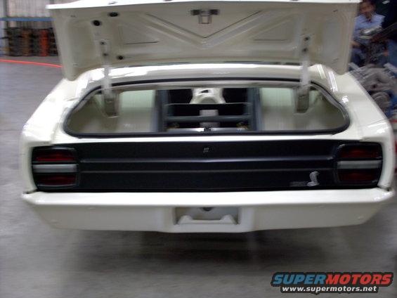 1963 Ford Fairlane rear with trunk open, black grille, cobra emblem