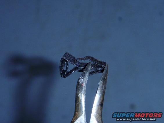 The clip has small hook that keep the clip from seperating.  These need to be nipped off, so a screwdriver can be used later.  I used needle nose pliers and the hooks broke off rather easily.