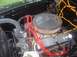 1949 Ford F1 - Close-up view of a vehicle's engine bay, highlighting the air cleaner and spark plug wires.