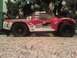 1984 Ford Bronco - RC truck with racing decals sits on carpet in front of a Christmas tree.
