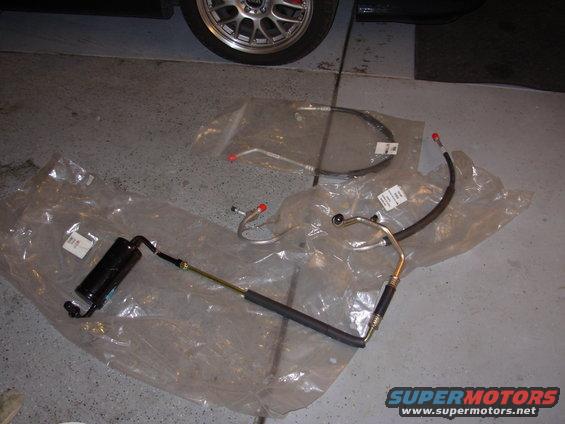 dscn0111.jpg New AC parts. Accumulator discharge line liquid line with orifice tube. 
