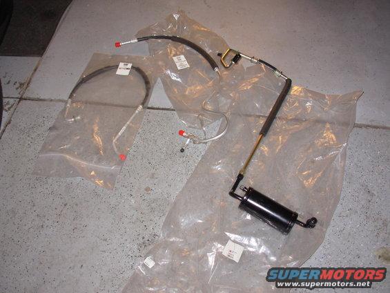 dscn0112.jpg New AC parts. Accumulator discharge line liquid line with orifice tube. 
