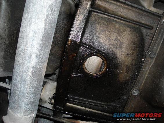 Before twisting a wrench, I decided to try to find the oil leak. I am 99% sure it is the rear main seal.
The top of the engine looks pretty clean.