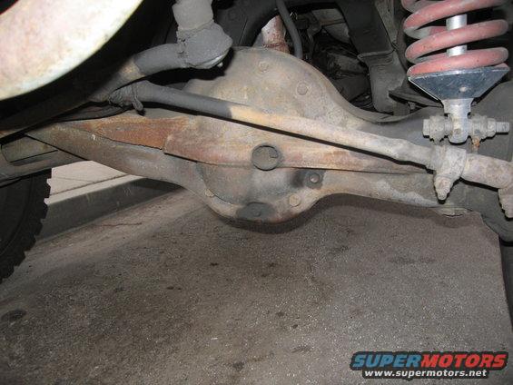 Rear axle and suspension parts with "SUPERMOTORS.NET" visible