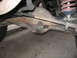 1986 Ford Bronco - Close-up view of rear axle and suspension components, with a watermark for SUPERMOTORS.NET.