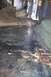 1992 Ford C-350 (Centurion Conversions) - The interior floor of a vehicle shows significant wear and staining.