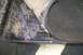 1992 Ford C-350 (Centurion Conversions) - A wrench rests on a metal surface with carpet, suggesting interior vehicle work.