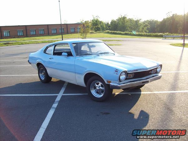 Blue and white 1973 Ford Maverick coupe parked in a lot, front 3/4 view