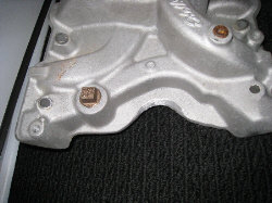 Aluminum intake manifold with a square port and bolt holes