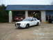 2003 Ford Crown Victoria - A white police car is parked outside the Seabrook Volunteer Fire Department's El Lago Station, with a fire truck visible inside.