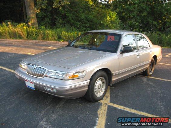 1995 Mercury Grand Marquis sedan parked in a lot, front 3/4 view
