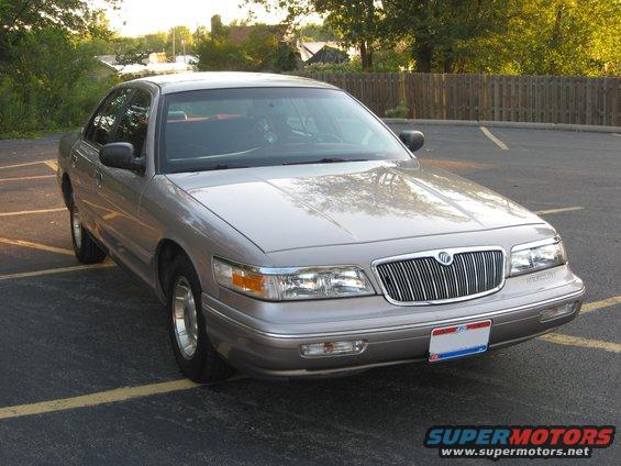 Tan 1995 Mercury Grand Marquis parked in a lot