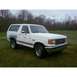 1989 Ford Bronco - White 1989 Ford Bronco with a three-quarter front view, parked outdoors.