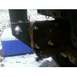 1989 Ford Bronco - A close-up view of a trailer hitch assembly, with a blue cooler visible behind it.