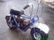 1970 Honda Trail - This blue mini bike features chrome handlebars and fenders, with a black seat and exposed engine.