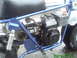 1970 Honda Trail - Side view of a blue mini bike, its engine and black seat. The website www.supermotors.net is visible.