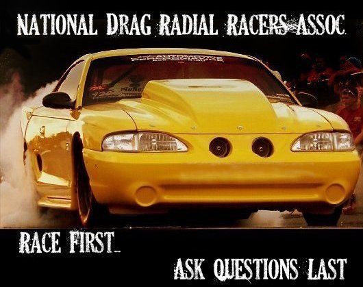 Yellow 1994 Mustang drag car doing a burnout