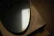 2002 BMW M3 - A damaged mirror, likely for a vehicle, is shown in its packaging.