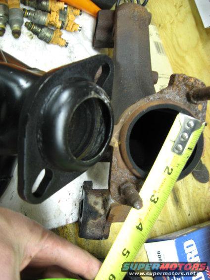 Stock manifold..measures 2 3/8" I am not going to do this work and worry at night of the possibility of less flow. 
