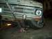 1971 Ford F-100 - Front view of a 1971 Ford F-100 being worked on with a floor jack.