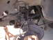 1992 Ford Taurus - Close-up view of the front suspension system, showing the brake rotor, CV axle, and various linkage components.