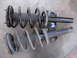 1992 Ford Taurus - Comparison of two car suspension struts, likely for front or rear axle replacement.