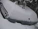 1969 Ford Torino - A 1969 Ford Torino is buried in snow, with only its front grille and headlights visible.