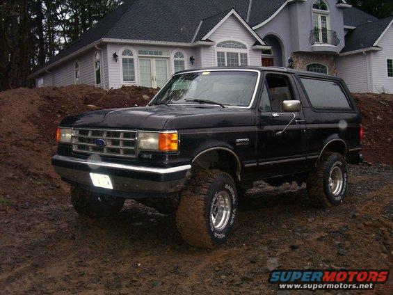 Black 1988 Ford Bronco on muddy terrain