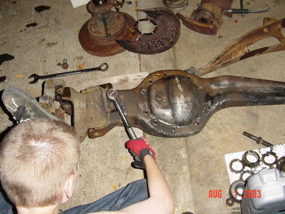 The boy helping to take apart the new beam