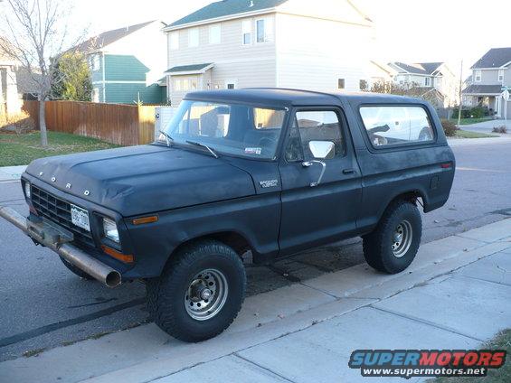 Black 1979 Ford Bronco, 3/4 front view, parked on street