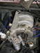 1986 Ford Bronco - vacuum lines, throttle and tv cables removed, wiring for iac, egr, tps and dissy unplugged, coolant hoses removed.