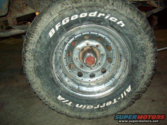 BFGoodrich All-Terrain T/A tire mounted on a steel wheel with a red center cap