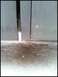 1996 Ford Bronco - Close-up view of the rear door gap on a vehicle, showing some rust and snow on the ground. The SuperMotors.net logo is present.