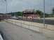 1999 Ford Taurus - Cars are staged at the starting line of a drag strip with grandstands visible.