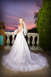 2001 Pontiac Trans Am - Bride poses for a photo on a balcony with a colorful sunset in the background.