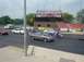1999 Ford Taurus - A gray sedan is on the race track at Norwalk Raceway Park, with spectators in the background.