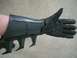 1995 Ford Probe - A black Batman glove with a gauntlet and spikes is shown with the thumb extended upwards.