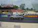 1999 Ford Taurus - Two sedans are lined up on the drag strip at Norwalk Raceway Park, ready for a race.