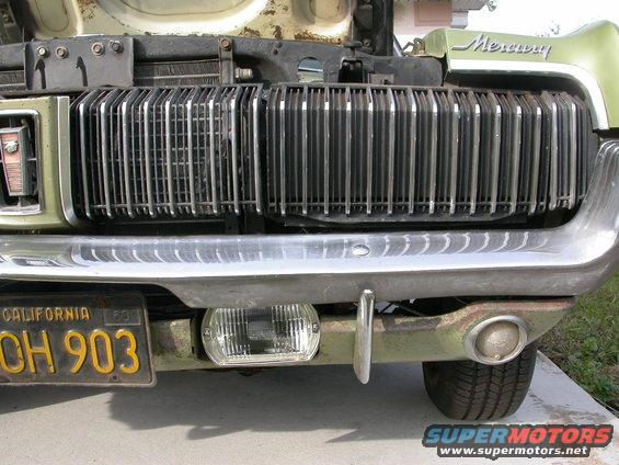Front view of a 1968 Mercury Cougar's grille and bumper. California license plate OH 903 is visible