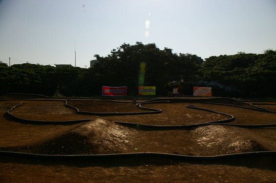 RC car track with jumps and banners in background