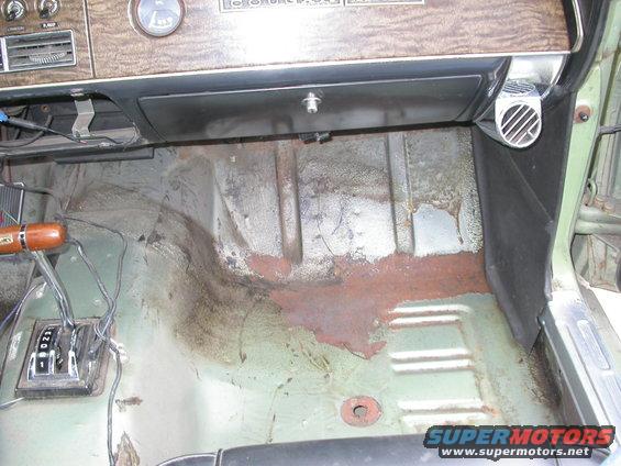 1968 Mercury Cougar interior floor showing rust and automatic transmission shifter