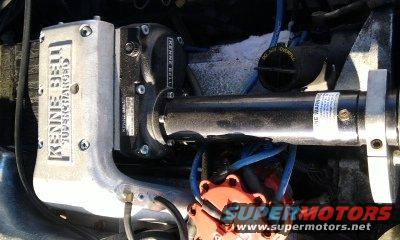 Engine bay with a Kenne Bell supercharger installed. Shows intake manifold and some engine components