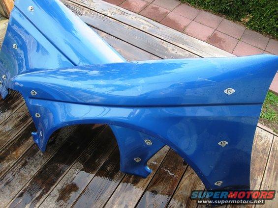 Blue Autofab hood and fender assembly with visible rivets