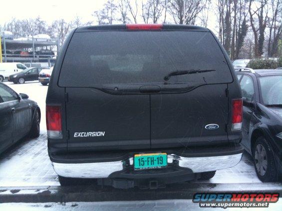 Black Ford Excursion rear with license plate 15-FH-19