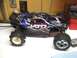 1996 Ford Bronco - This remote control monster truck features a black body with blue flame graphics and a JATO 3.3 decal.