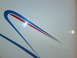 2003 Peterbilt 379 - Detail of a white truck's side blue and red racing stripes.