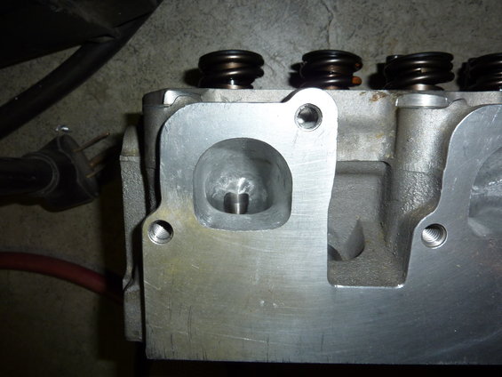 Close-up of an engine cylinder head with valve springs visible